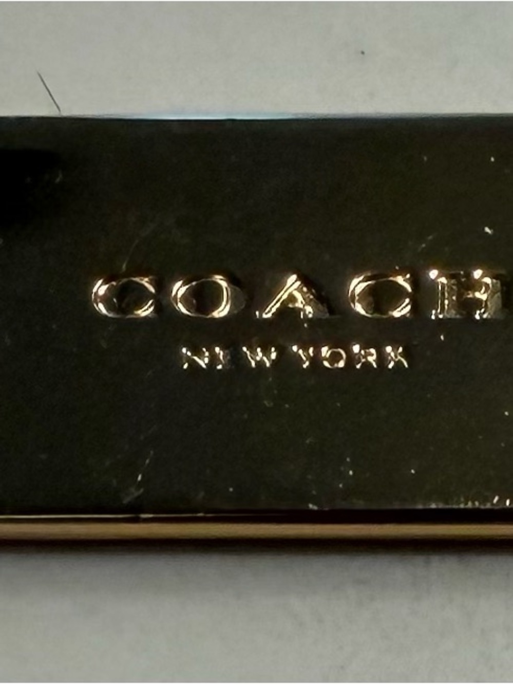 Coach Gold Bag Tag